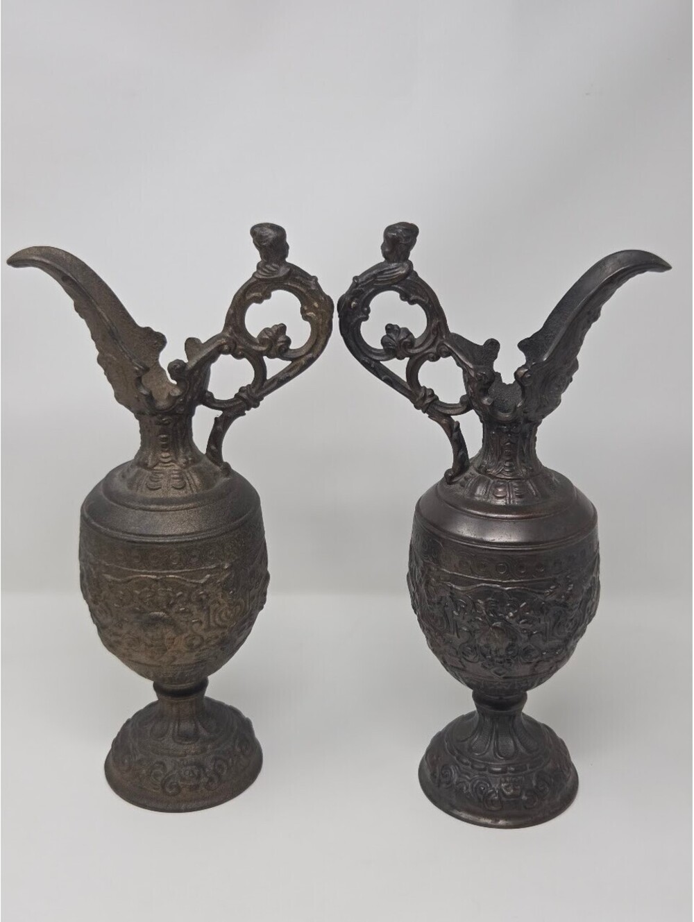 Pair Of Ornate Cast Bronze Decorative Ewers With Figural Handles & Relief Detail
